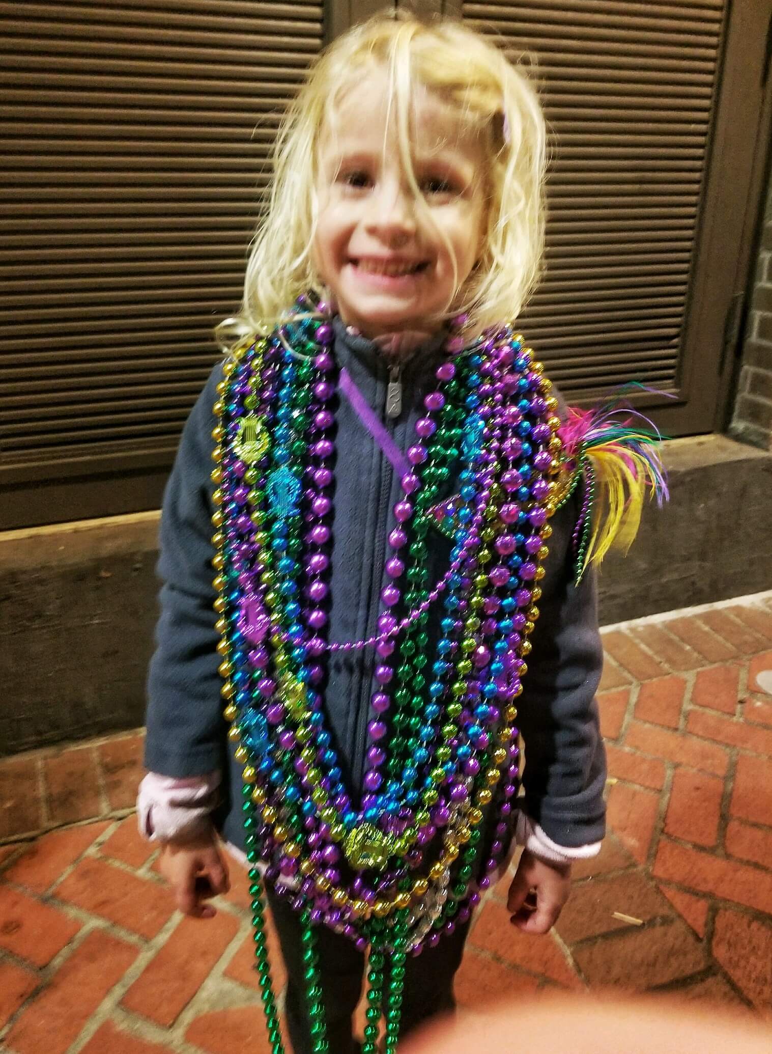 girl wearing bead necklaces