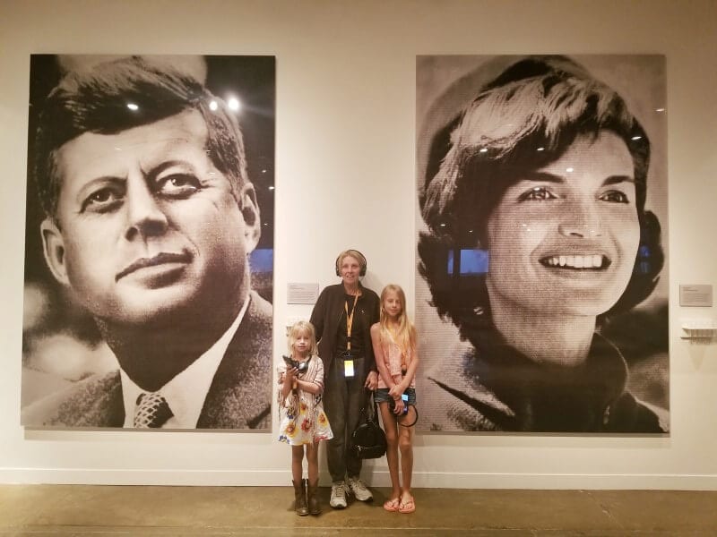 girls and their nan in front of jfk and jackie photos JFK Dallas museum