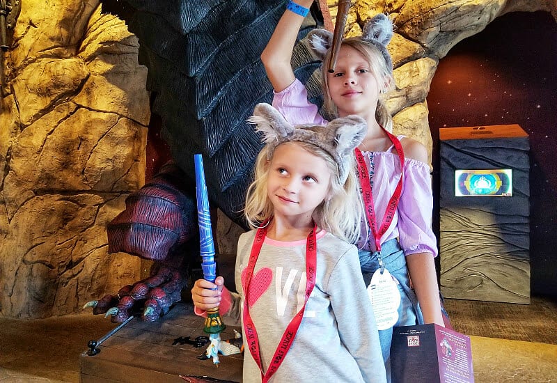 girls holding toy wands