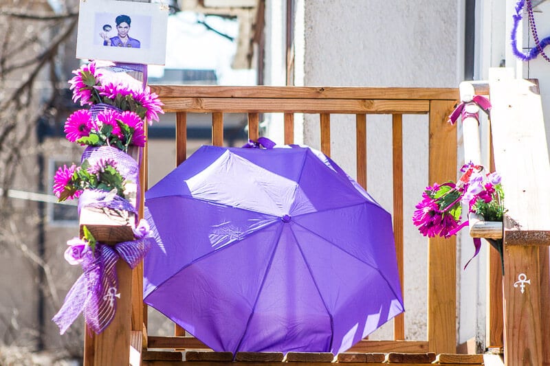 purple umbrella on steps of Prince House featured in Purple