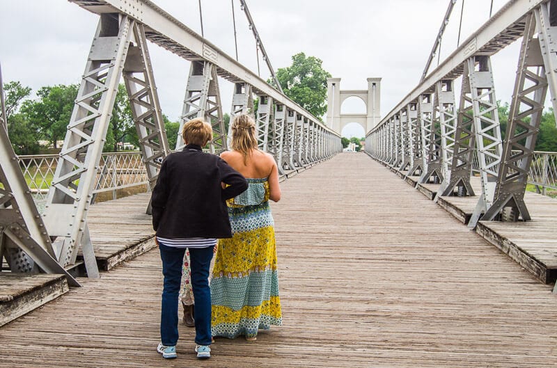 caz and her mom stqnding on Waco Suspension bridge 