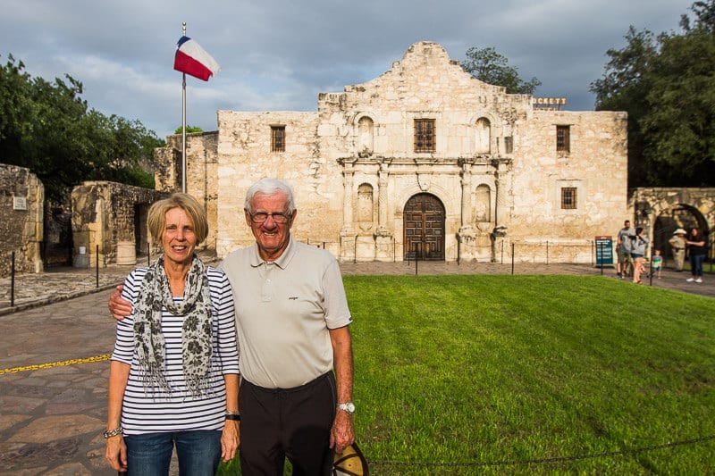 mum and dad standing outside the alamo