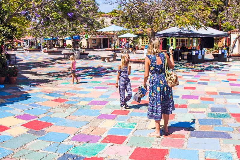 woman and girl standing on colored tiles at Spanish Village Art Center, Balboa Park