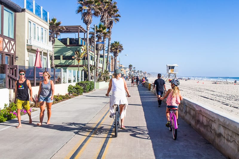 woman and girl Bike riding in Pacific Beach, 