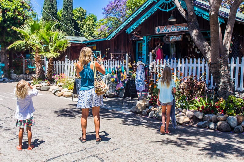 people looking at colorful historic home in Los Rios Historic District,