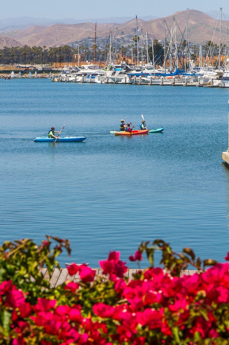 people kayaking Ventura Harbor Village in California
