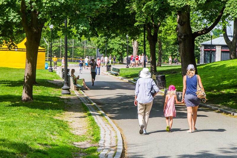 people walking through a park