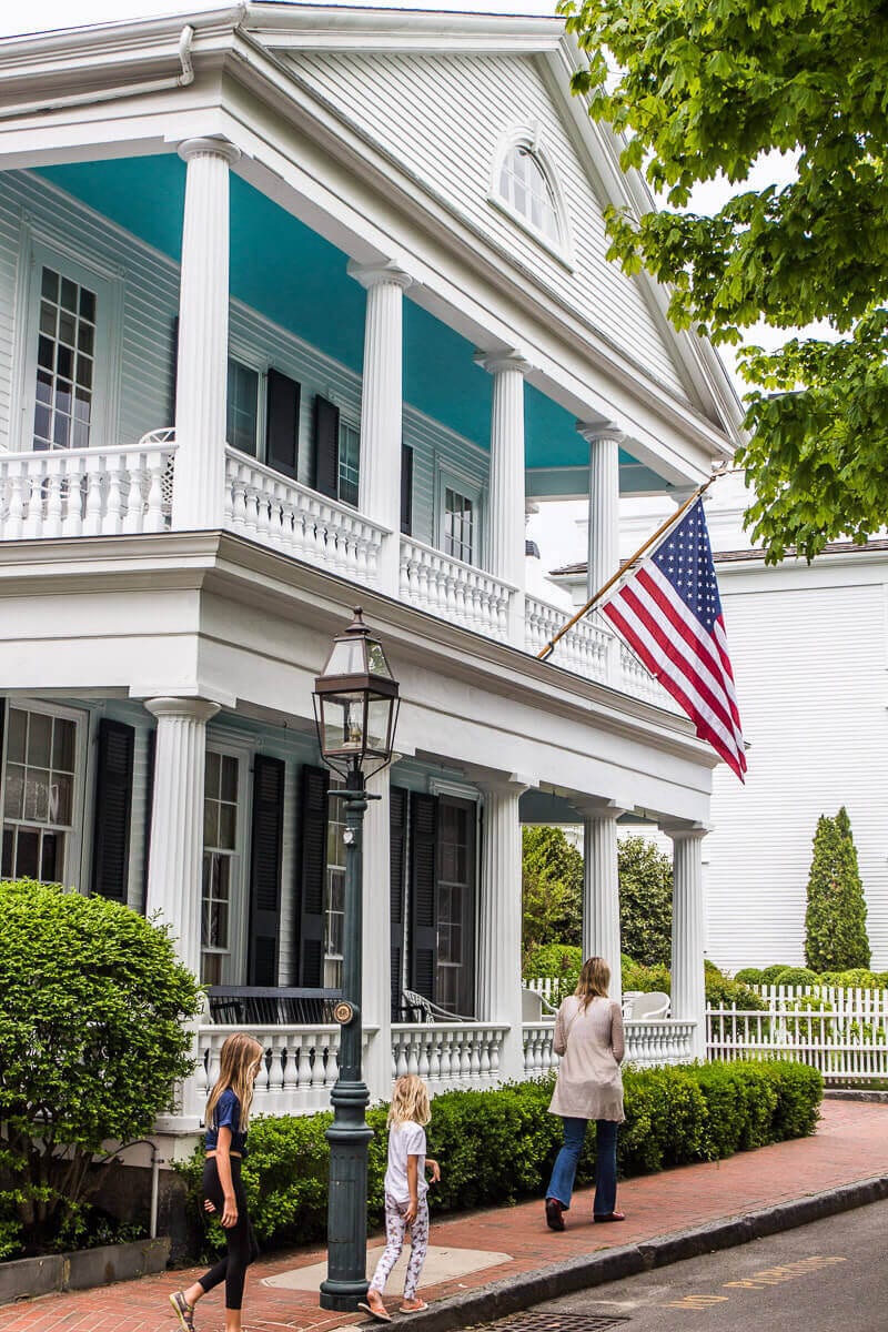 a white house with an american flag