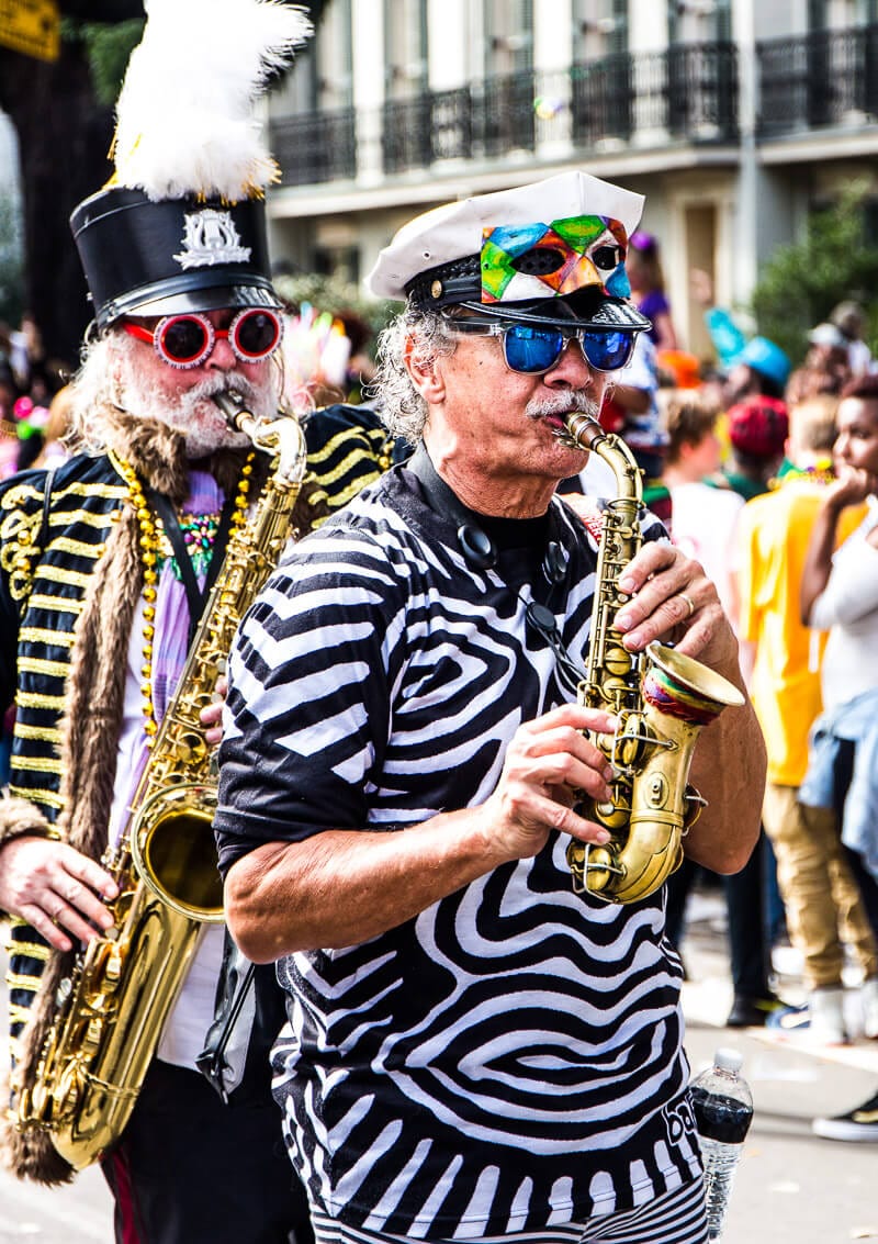 man playing trumpet in the new orleans parade