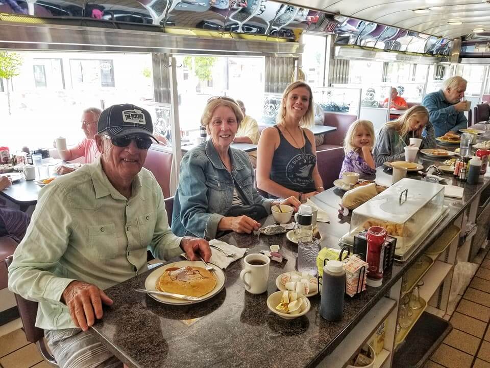 people sitting at Lincoln Diner bench