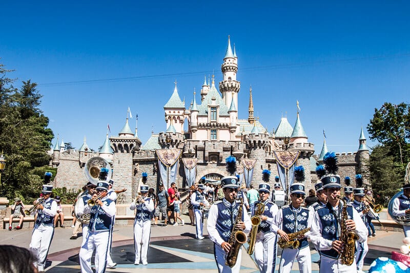 band playing in front of a castle