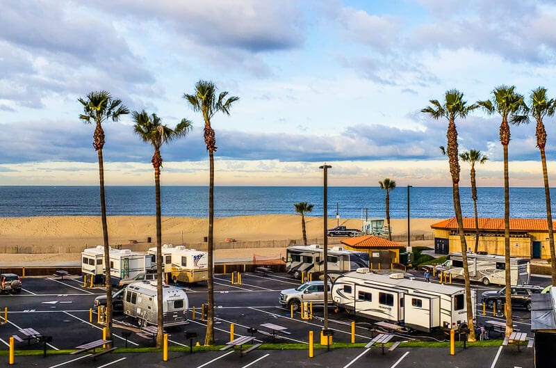 caravans parked next to a beach