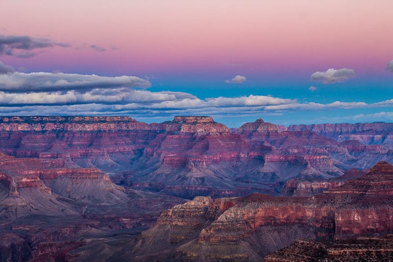 a canyon with purple and pink skies