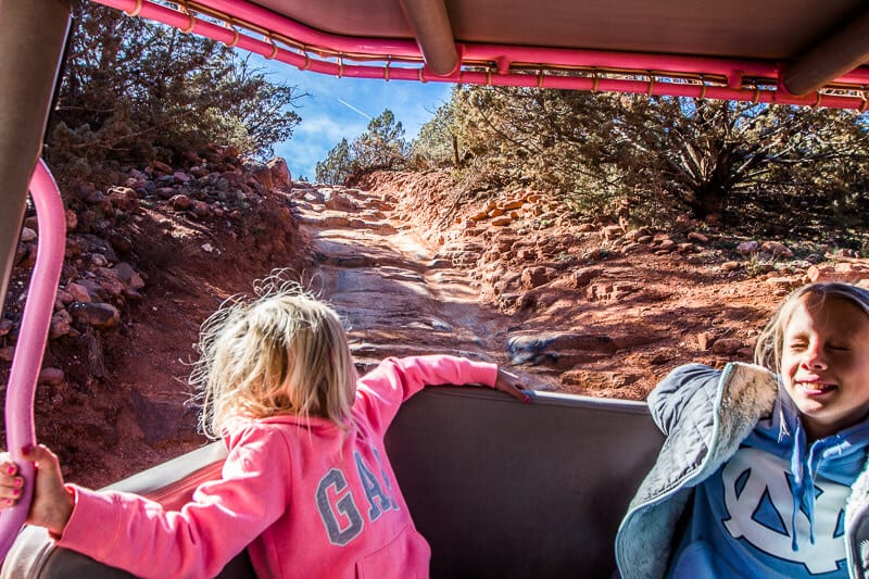 savannah and kayral in Pink Jeep looking at steep ricky track and laughing