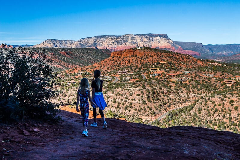 people standing in front of a canyon