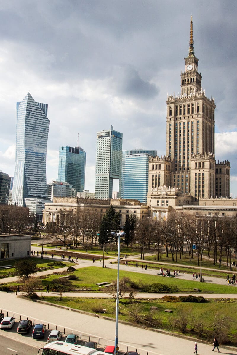 high rises and old clock tower in warsaw