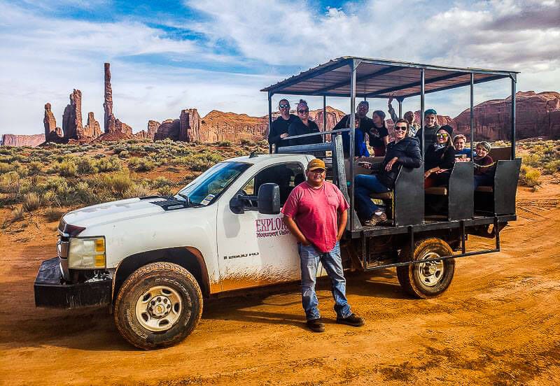 people in jeep with  tour guide in Monument Valley