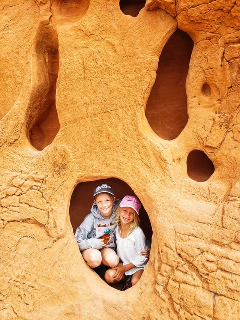 girls posing in cave in rock