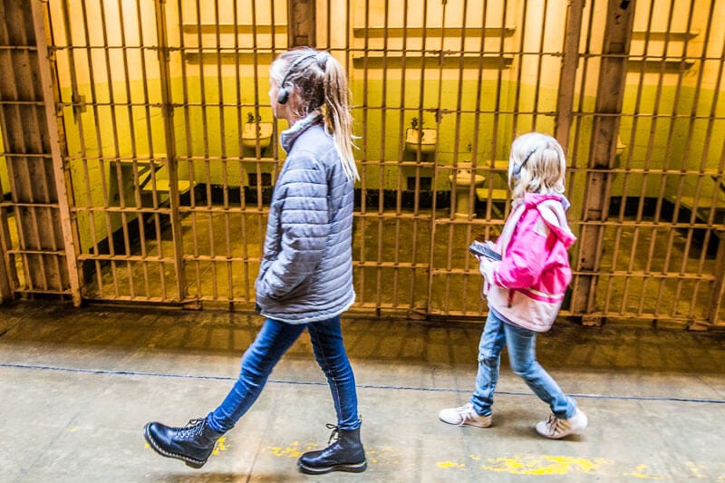 girls walking through a jail