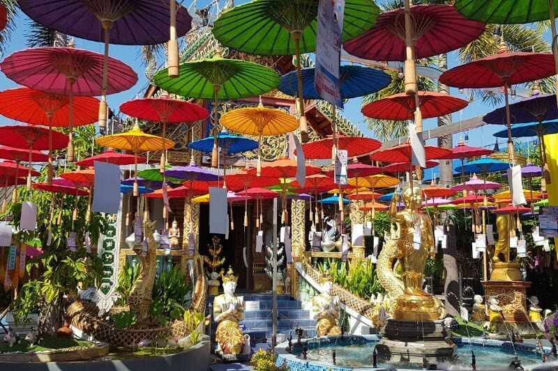  umbrellas on roof of Wat Phra Pan Buddhist Temple Chiang Mai Thailand