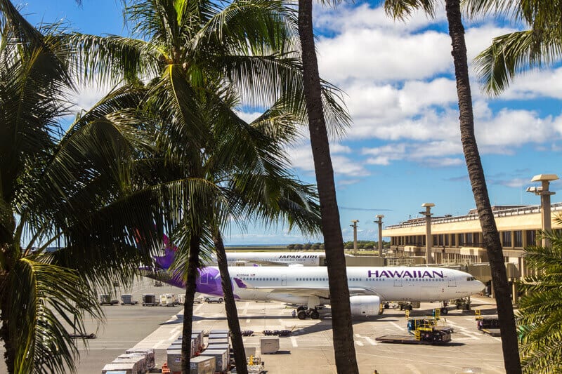 Hawaiian airlines plane docked at the gate