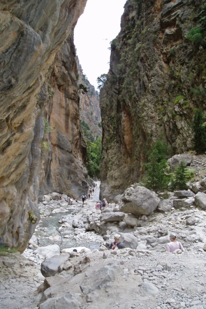 people hiking through the narrow Samaria gorge, Crete