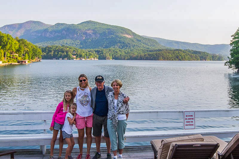 caz and family posing in front of Lake Lure North Carolina