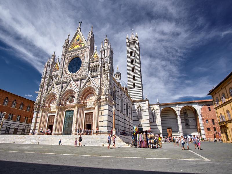 people outside the Cathedral of Siena, Tuscany Italy