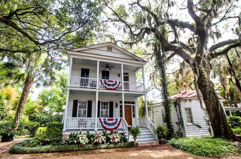 historic home under live oak trees