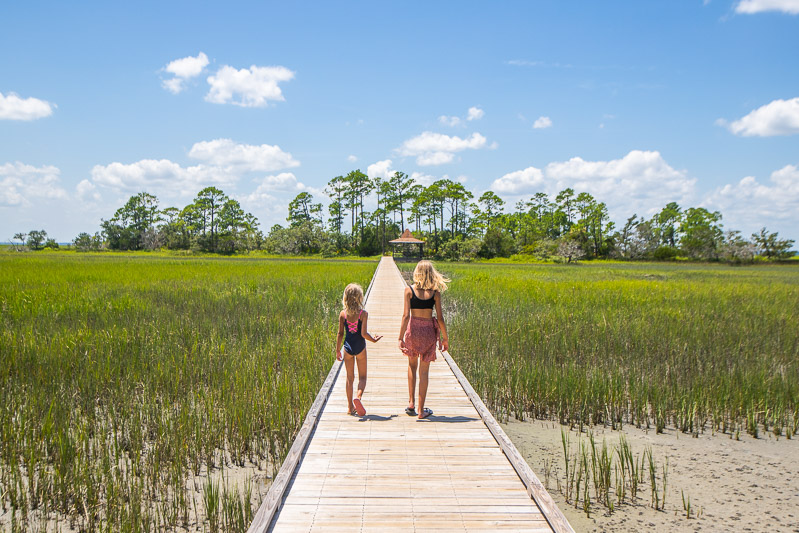 kalyyra and savannah walking on boardwalk Hunting Island State Park