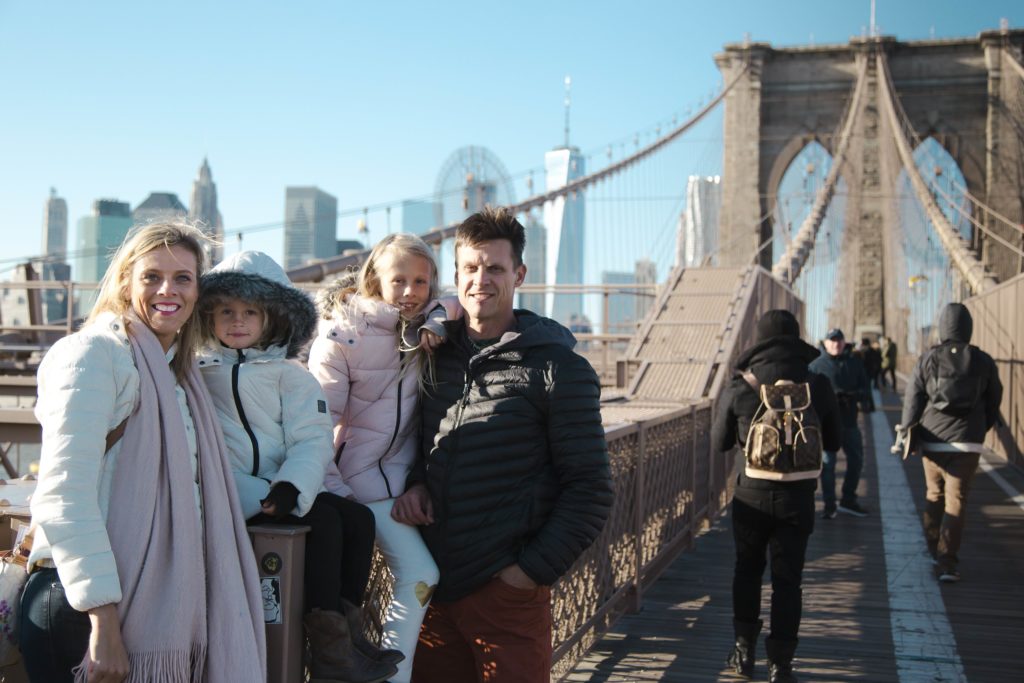 makepeace family posing on Brooklyn Bridge NYC