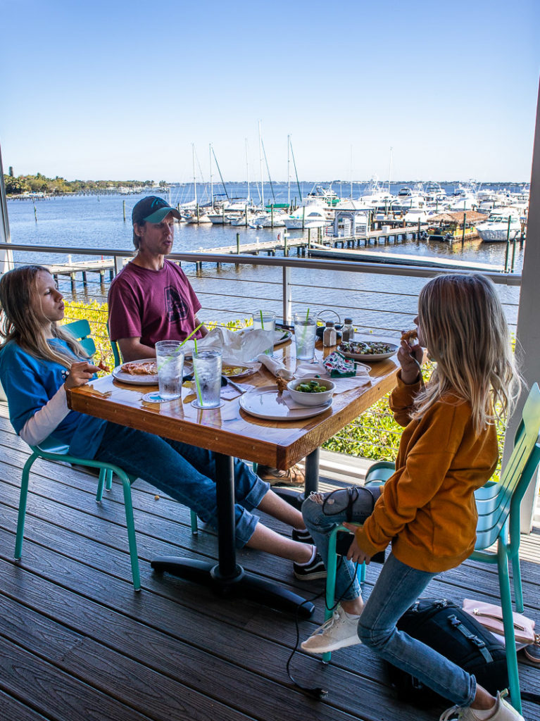 family sitting at patio TideHouse Waterfront Restaurant, Martin County, Florida