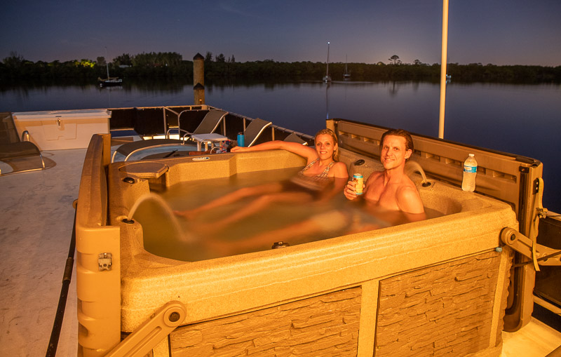 people sitting in spa on houseboat