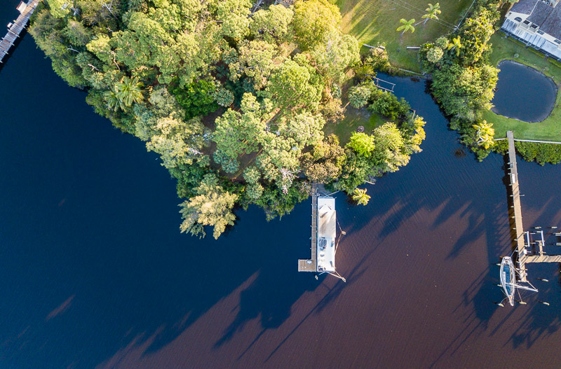 overhead view of a lake surrounded by trees