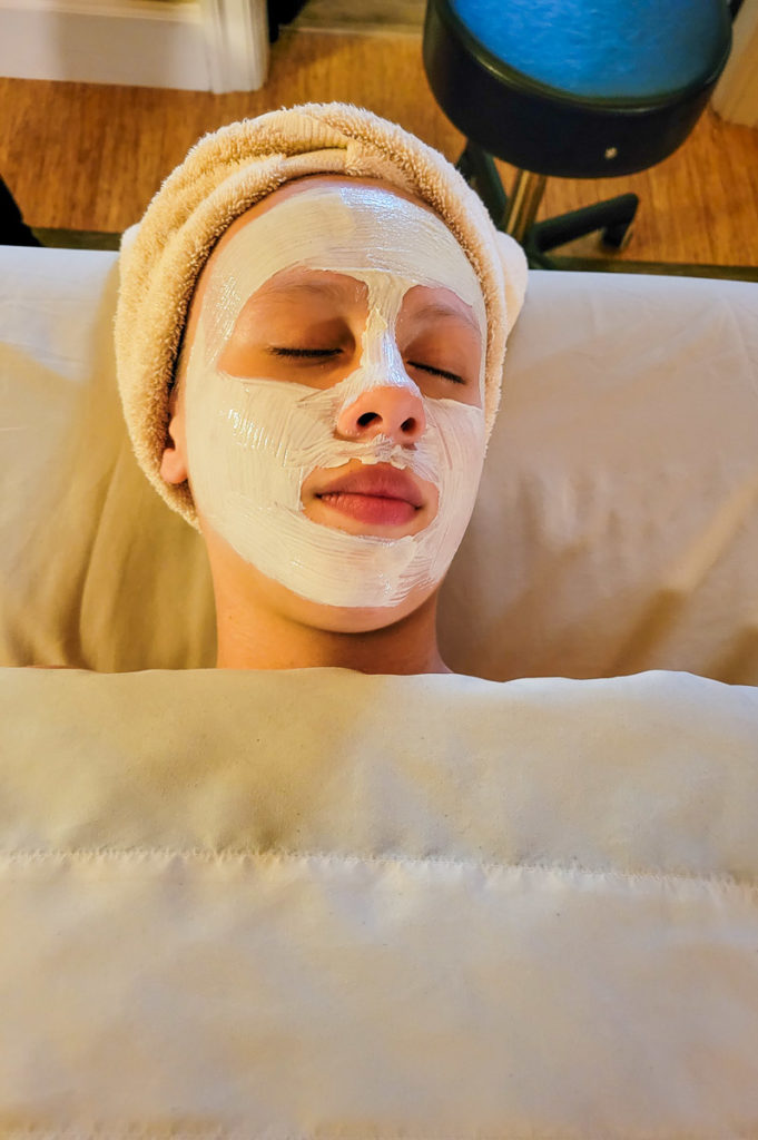 girl laying down wearing a face mask