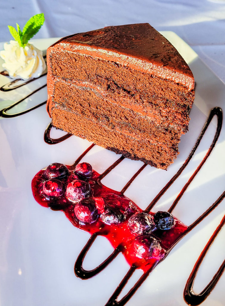 chocolate cake with berries on plate