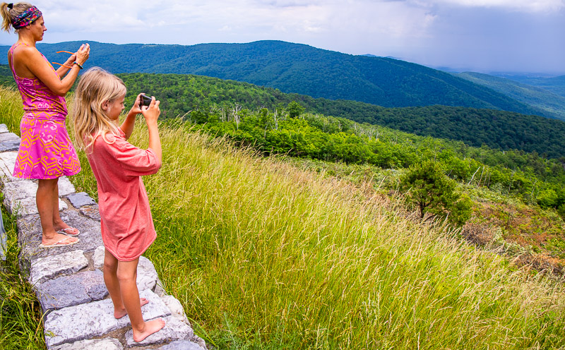 woman and girl taking photos of the Stunning views along Skyline Drive
