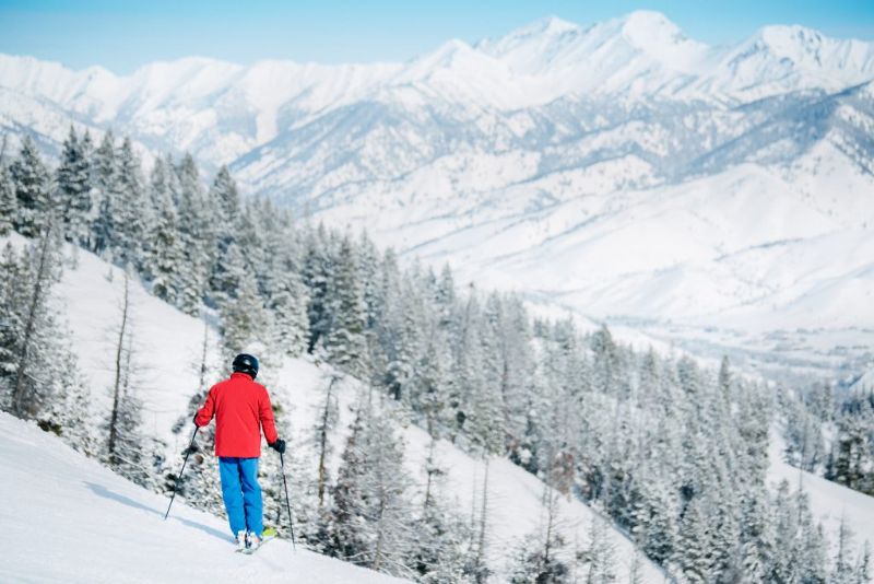 man on skis looking at snowy mountain views Sun Valley idaho 