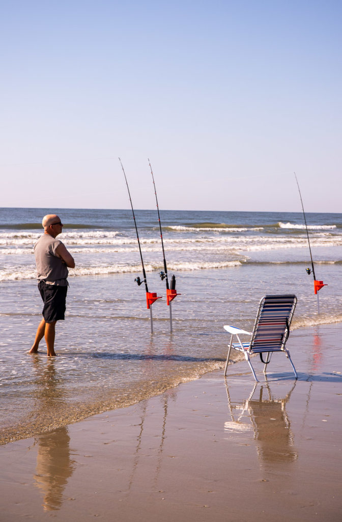 man fishing at the beach