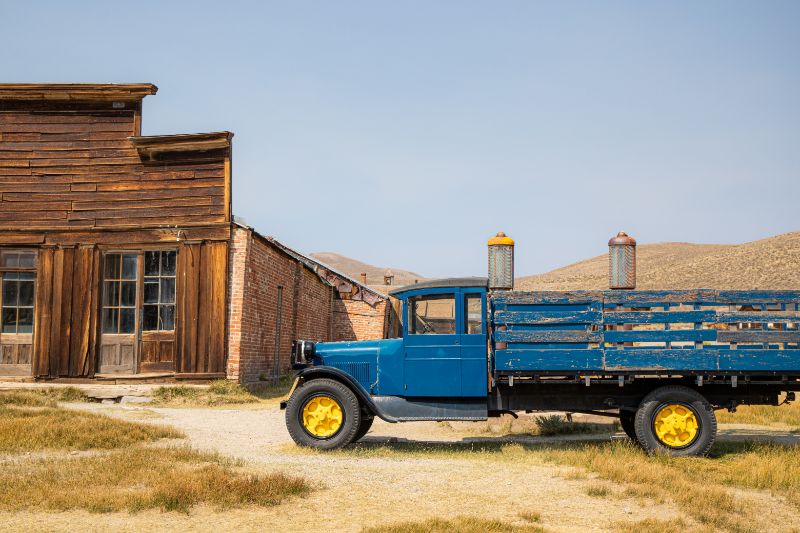 truck in front of old wooden building