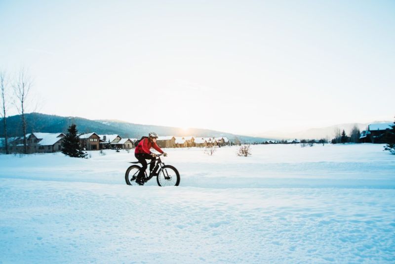 person on a fat tire bike on the snow 