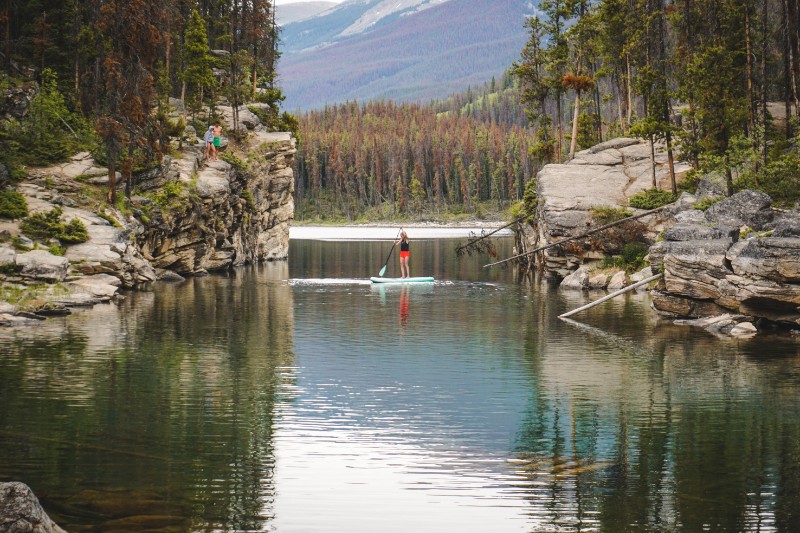 girl paddleboarding on Horseshoe Lake, Jasper National Park