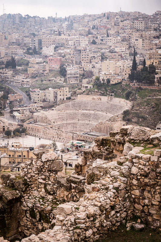 Views of ancient Roman Theater amongst the buildings and hills of amman