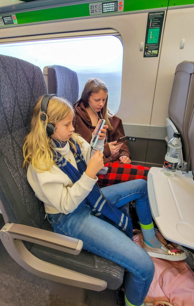 girls traveling on London to Bath by train