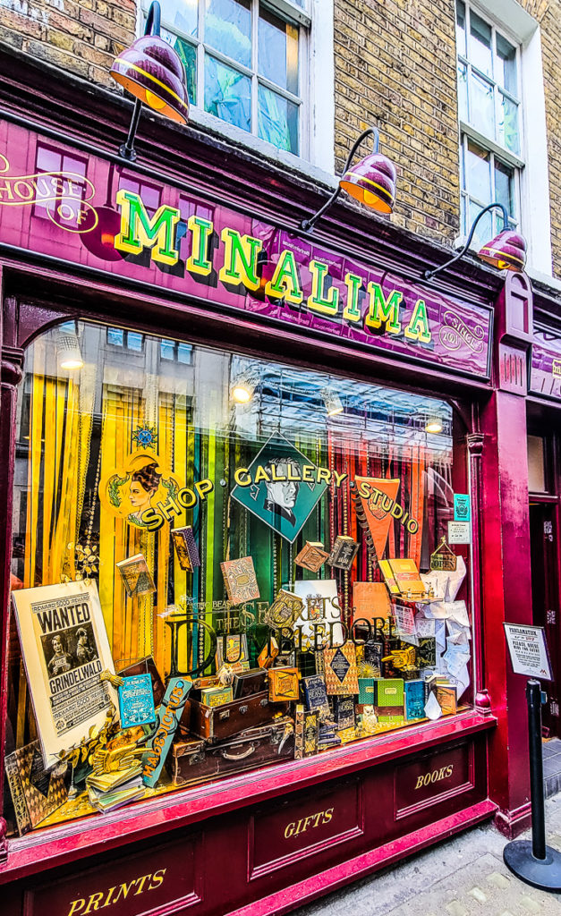red exterior of House of MinaLima with window displays