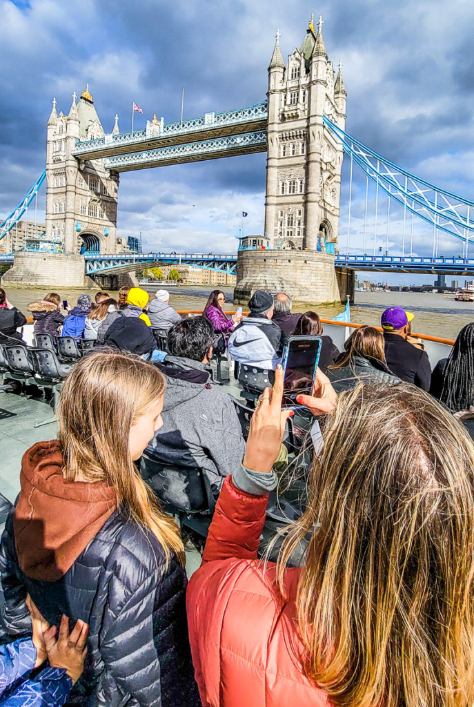 people taking photos of tower bridge