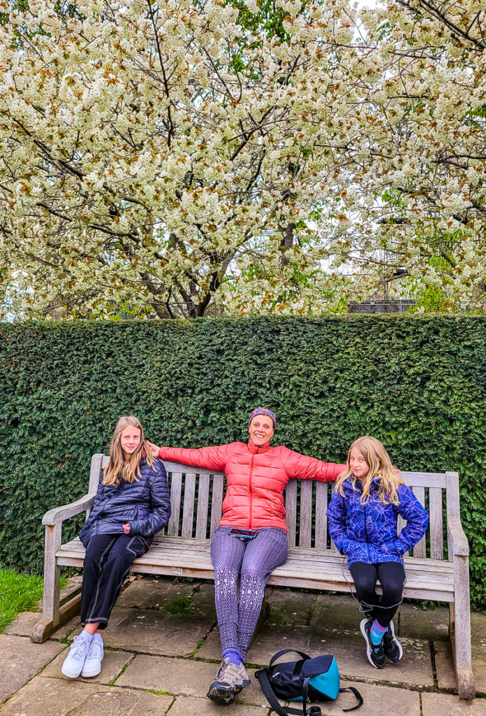people sitting connected  a parkland  bench