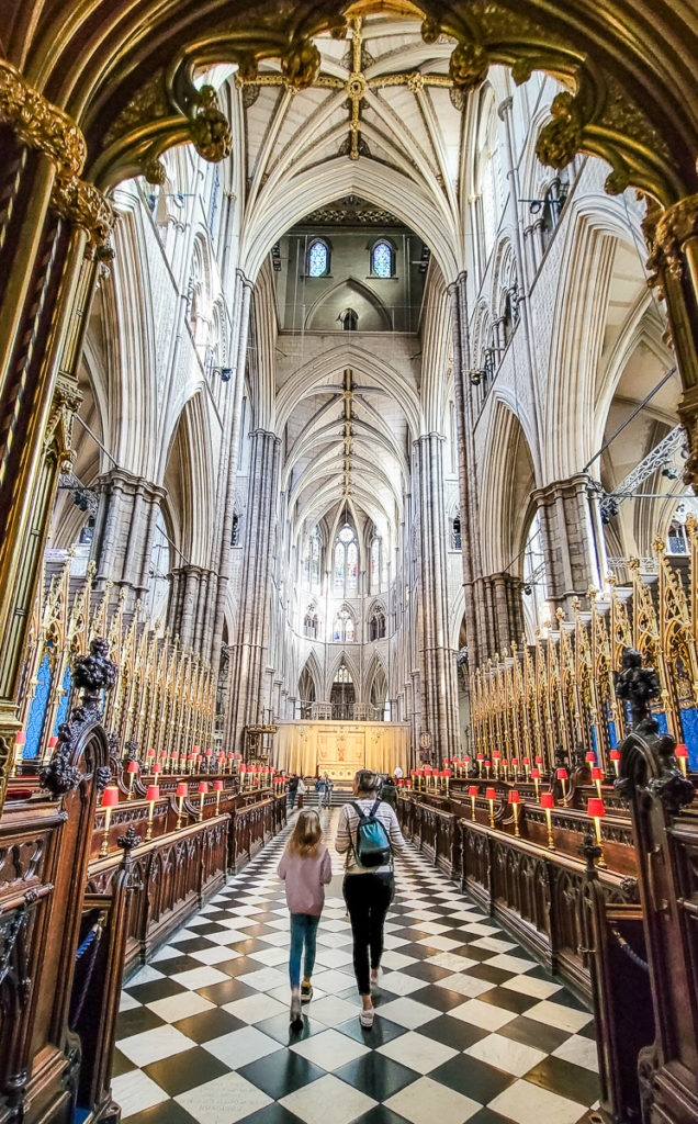 people walking down aisle in Westminster Abbey, London, England