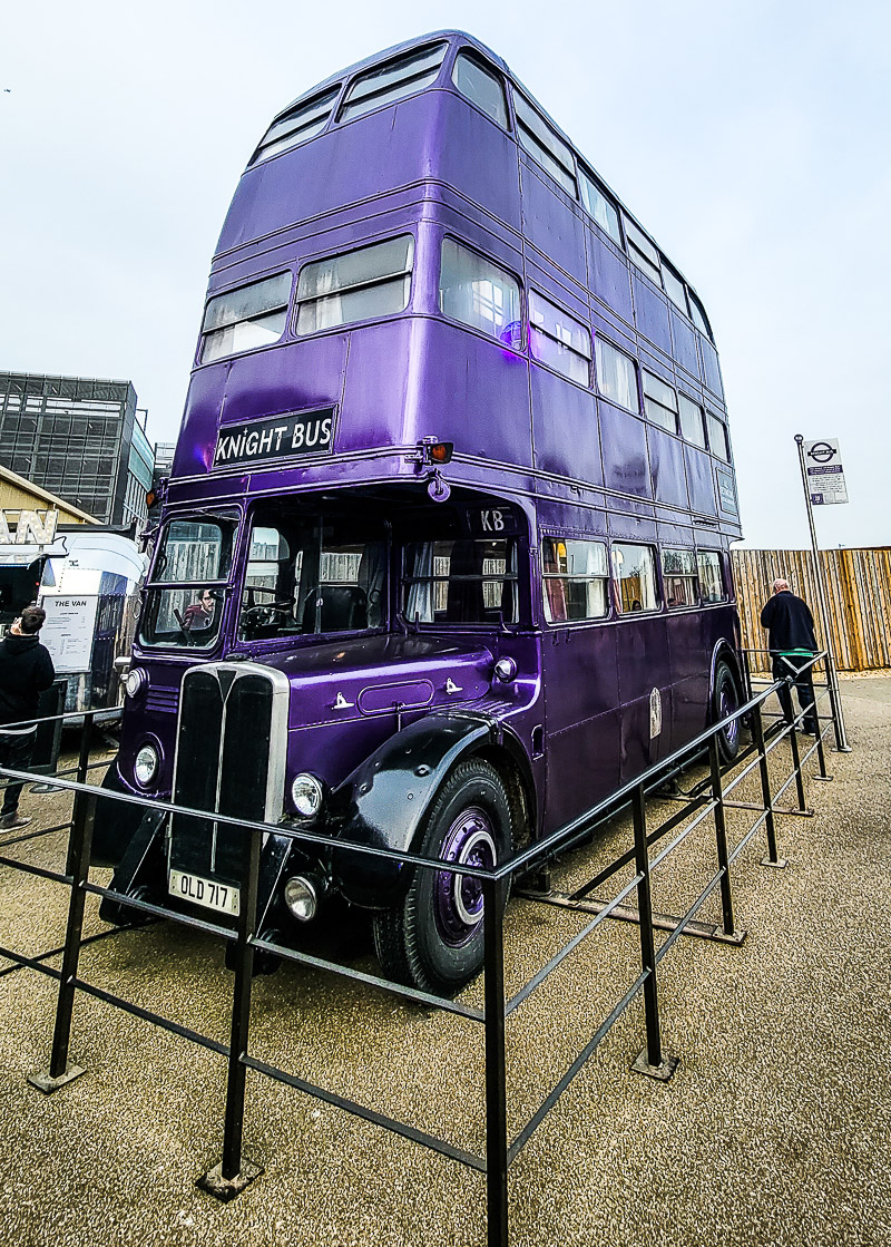 three story purple bus