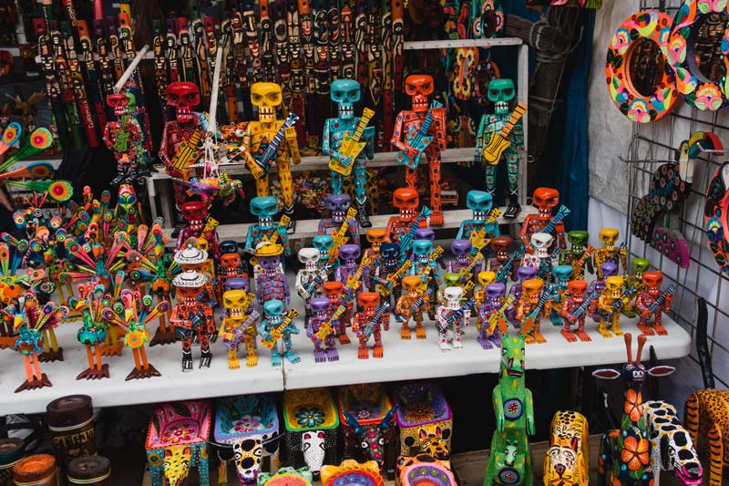 colorful wooden figures at te Chichicastenango markets in Guatemala